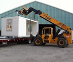 photo of completed component being loaded on semi trailer